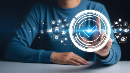 Man interacting with futuristic digital interface and verification symbol