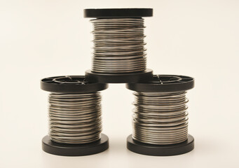 Coils with solder. Plastic coils with tin-lead solder. Materials for electronics repair.