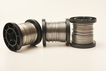 Coils with solder. Plastic coils with tin-lead solder. Materials for electronics repair.