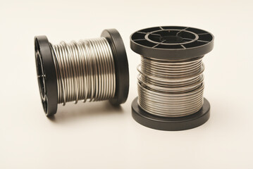Coils with solder. Plastic coils with tin-lead solder. Materials for electronics repair.