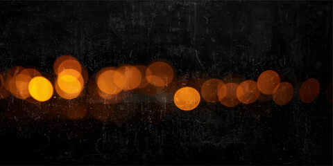 Glowing red hot chili peppers and burning candles reflect bright bokeh lights against a dark black background for a festive holiday celebration