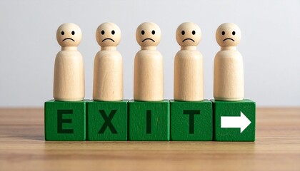 Row of Sad Wooden Peg People Standing on Green Blocks Spelling EXIT with Directional Arrow on a Wooden Surface