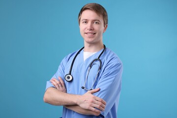 Portrait of medical assistant on light blue background