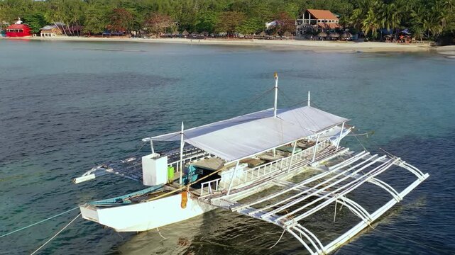 Aerial view of traditional outrigger boat on calm tropical sea, Philip