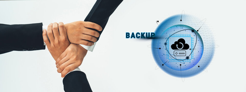 A diverse group of professionals collaborates on data backup solutions, showcasing teamwork and modern technology through hands joined together emphasizing unity and support. Trope - Powered by Adobe