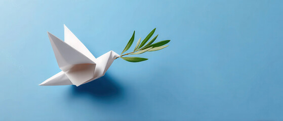 Origami dove carrying an olive twig symbolizes a call for world peace and an end to conflict