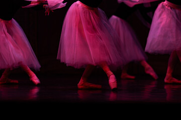 Closeup of ballerinas dancing on stage. © Ruslan