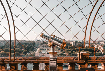 Paris, France: old telescope  on Eiffel tower viewing platform 