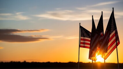American flags silhouetted against vibrant sunset
