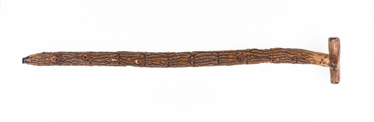 Old wooden shepherd's walking stick isolated on white background