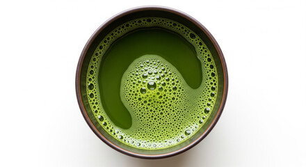 Top view of green tea matcha isolated on white background. It is a rich source of antioxidants and polyphenols. When preparing, the powder is partially dissolved in hot water, which increases the amou
