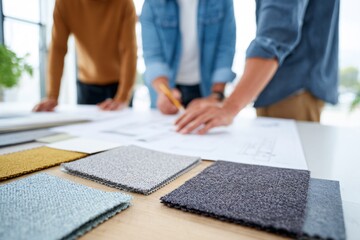 Family gathers to discuss renovation ideas with fabric samples and design plans on the table