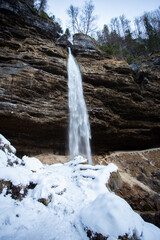 Pericnik waterfall in Vrata valley in Slovenia, winter landscape