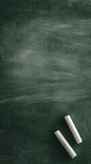 A subtly textured, dark green chalkboard surface, gently smudged with white chalk dust and faint erasing marks, provides a versatile and nostalgic background. Two pieces of white chalk rest neatly in 