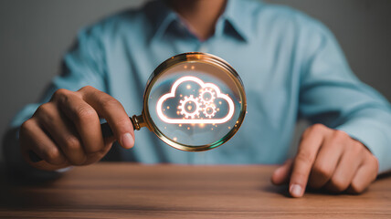 Cloud Computing Analysis and System Management Concept with Magnifying Glass Over Tech Gear Icon