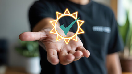 Close up of a hand holding a glowing sun icon with a green checkmark, symbolizing quality assurance, energy efficiency, and customer satisfaction