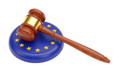 Wooden gavel resting on a European Union symbol, illustrating the legal framework and judicial authority within the European community.