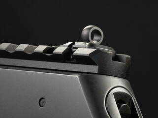 rear peep sight on a lever-action rifle with a rail