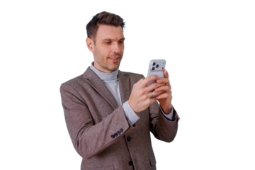 Man smiling while interacting with a smartphone, browsing social media or texting, using mobile technology with transparent background