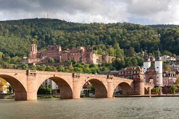 Heidelberg Germany Historic Old Bridge Neckar River and Castle Ruins.The Karl Theodor Bridge and castle on the hill. Heidelberg, Baden-Wurttemberg, Germany.
