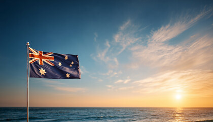 Waving flag of Australia against the background of a sunset or sunrise. Australia sky with flying flag beauty. Concept of national holidays. Australia Flag with Sunset Background.
