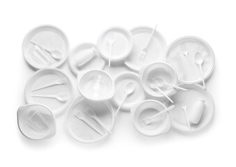 Different plastic tableware on white background