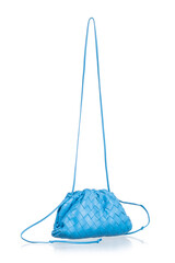 small blue lambskin handbag, photographed on a white background with reflection