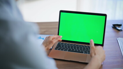 Healthcare professional talking green screen laptop in clinic office closeup