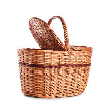 Wicker picnic basket on white background