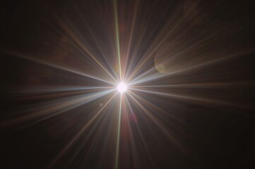 Radiant golden starburst with long, thin rays piercing through darkness