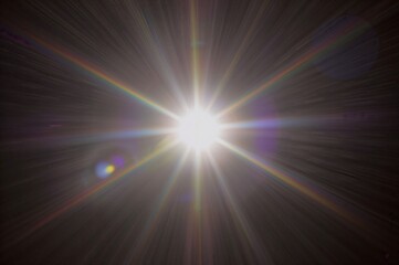 Powerful central light source emitting brilliant white rays and flares