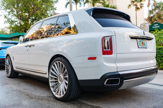 Miami, Florida, USA - February 16, 2025: Car Rolls Royce Cullinan parked. White car, low view. Rolls Royce Cullinan car. Luxury convertible car Rolls Royce Cullinan