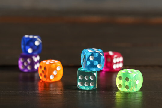 Colorful game dices on wooden background