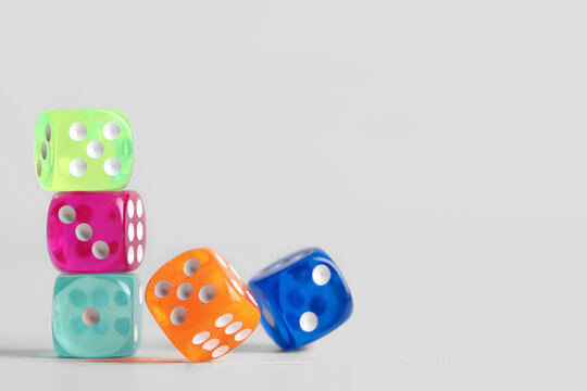 Colorful game dices on grey background