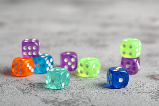 Colorful game dices on grey background