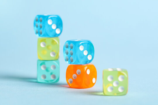 Colorful game dices on blue background