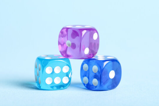 Different game dices on blue background