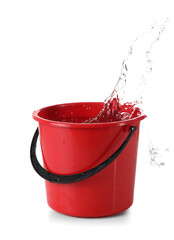 Red plastic bucket with water and splashes on white background © Pixel-Shot