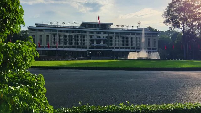 Ho Chi Minh City, Vietnam - September 18, 2025: View of the Independence or Reunification Palace, formerly Saigon. Dinh Choc Lop. A beautiful fountain sprays in front of the palace in bright daylight.