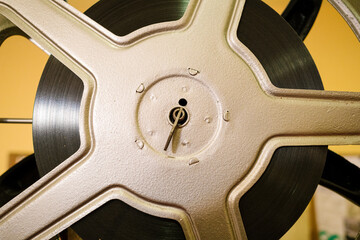 Vintage film reel running on movie projector