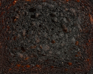 Isolated slice of burnt toast closeup