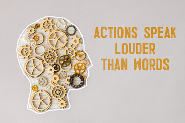 Actions speak louder words symbol. Concept words Actions speak louder than words on wooden blocks.