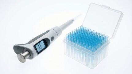 Micropipette and filter tips kit arranged on white laboratory work surface