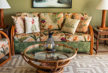 Tropical living room featuring rattan furniture and hawaiian decor