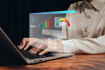 Business performance concept. Woman using laptop with virtual KPI dashboard interface, data analytics, performance measurement, strategic management, digital reporting