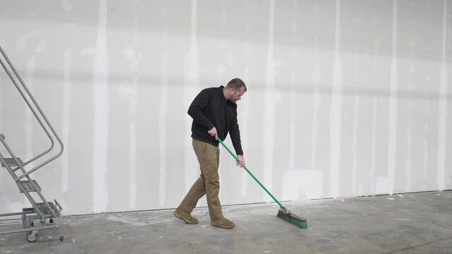 Man sweeping jobsite