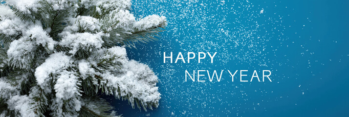 Snow-dusted evergreen branches frame elegant New Year greeting against blue.