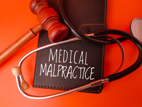 Conceptual representation of medical malpractice, involving a gavel and stethoscope