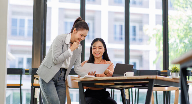 Business women and graphs on tablet screen for finance results, profit growth and budget review. Staff, team and digital with financial report, revenue stats and dividend comparison of risk assessment - Powered by Adobe