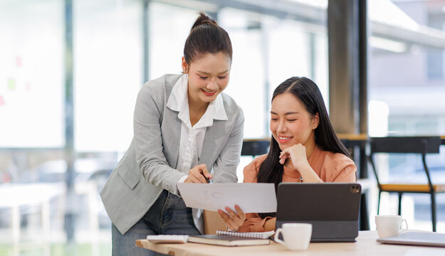 Business women and graphs on tablet screen for finance results, profit growth and budget review. Staff, team and digital with financial report, revenue stats and dividend comparison of risk assessment - Powered by Adobe